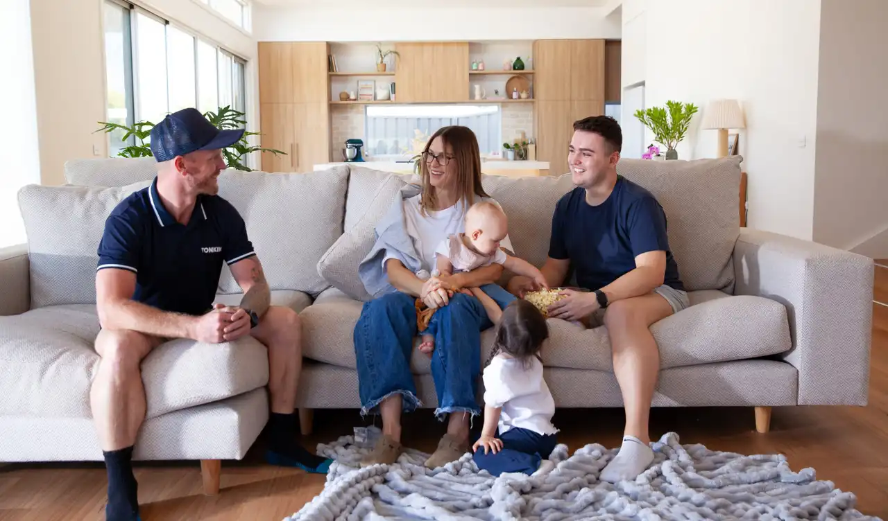 Tonkin tradie talking to a family